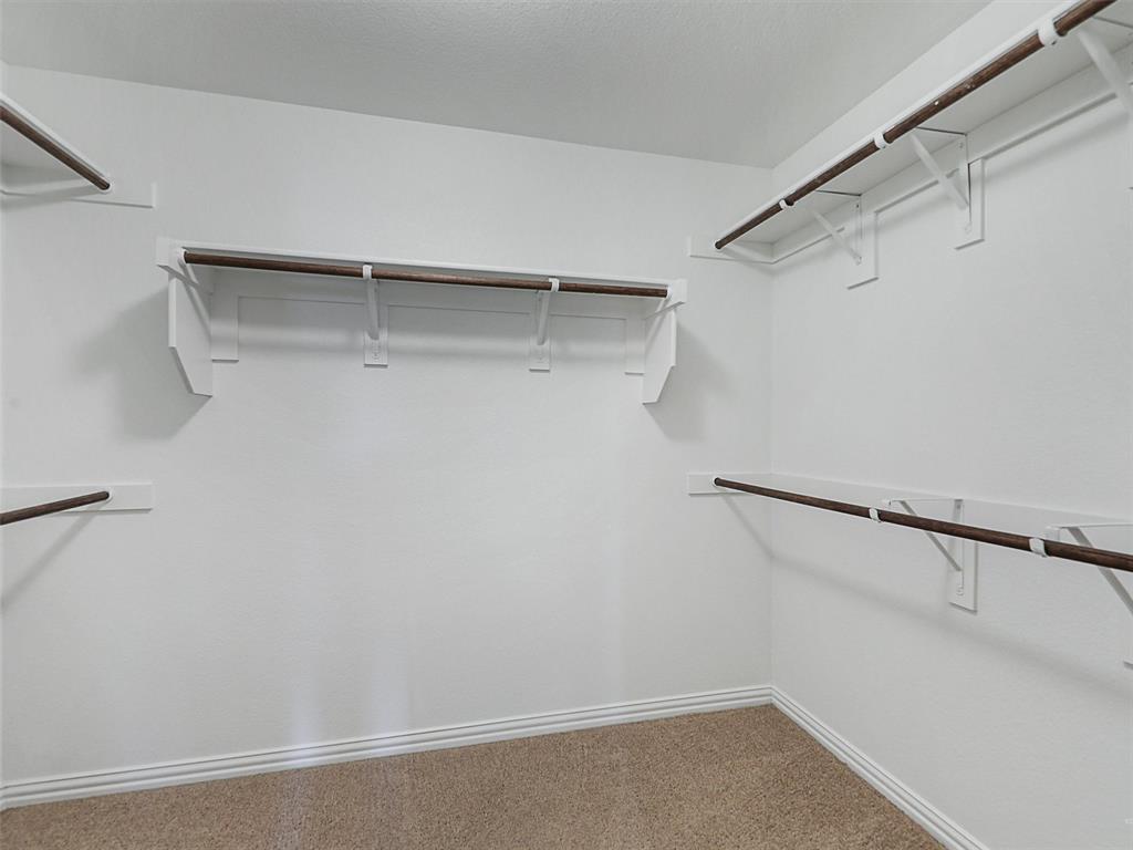 910 Torrey Avenue Princeton, TX 75407 - Photo 23 of 39 a view of a room with racks on the wall