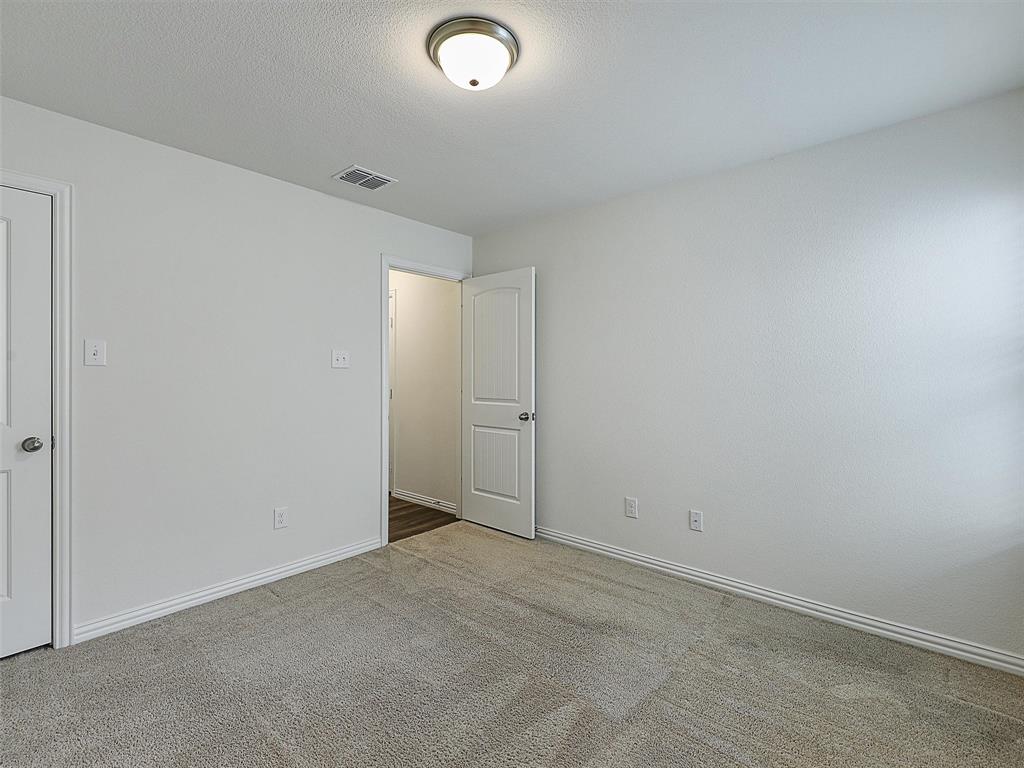 910 Torrey Avenue Princeton, TX 75407 - Photo 26 of 39 an empty room with an entryway