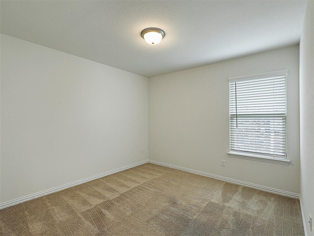 910 Torrey Avenue Princeton, TX 75407 - Photo 28 of 39 an empty room with a window