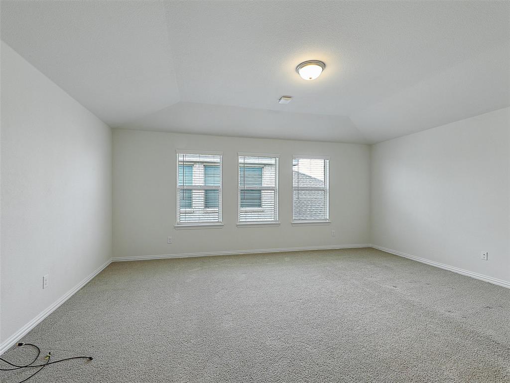 910 Torrey Avenue Princeton, TX 75407 - Photo 32 of 39 an empty room with a window