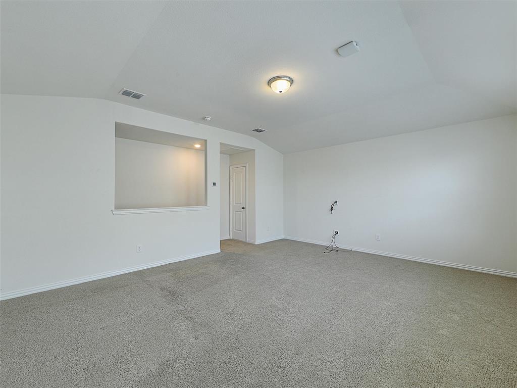 910 Torrey Avenue Princeton, TX 75407 - Photo 33 of 39 an empty room with a empty space and windows