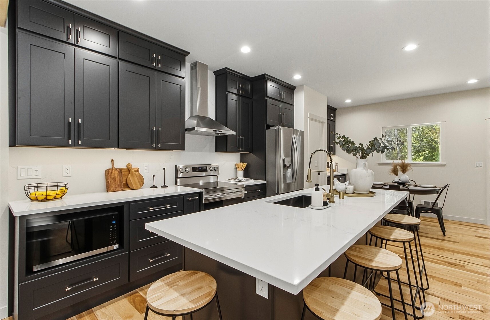 2816 Callow Road Lake Stevens, WA 98258 - Photo 14 of 34 a kitchen with a sink a stove and chairs