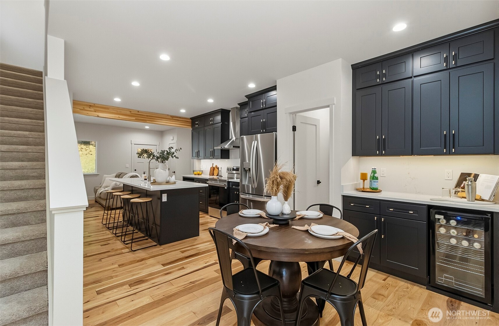 2816 Callow Road Lake Stevens, WA 98258 - Photo 19 of 34 a kitchen with a table chairs refrigerator and cabinets