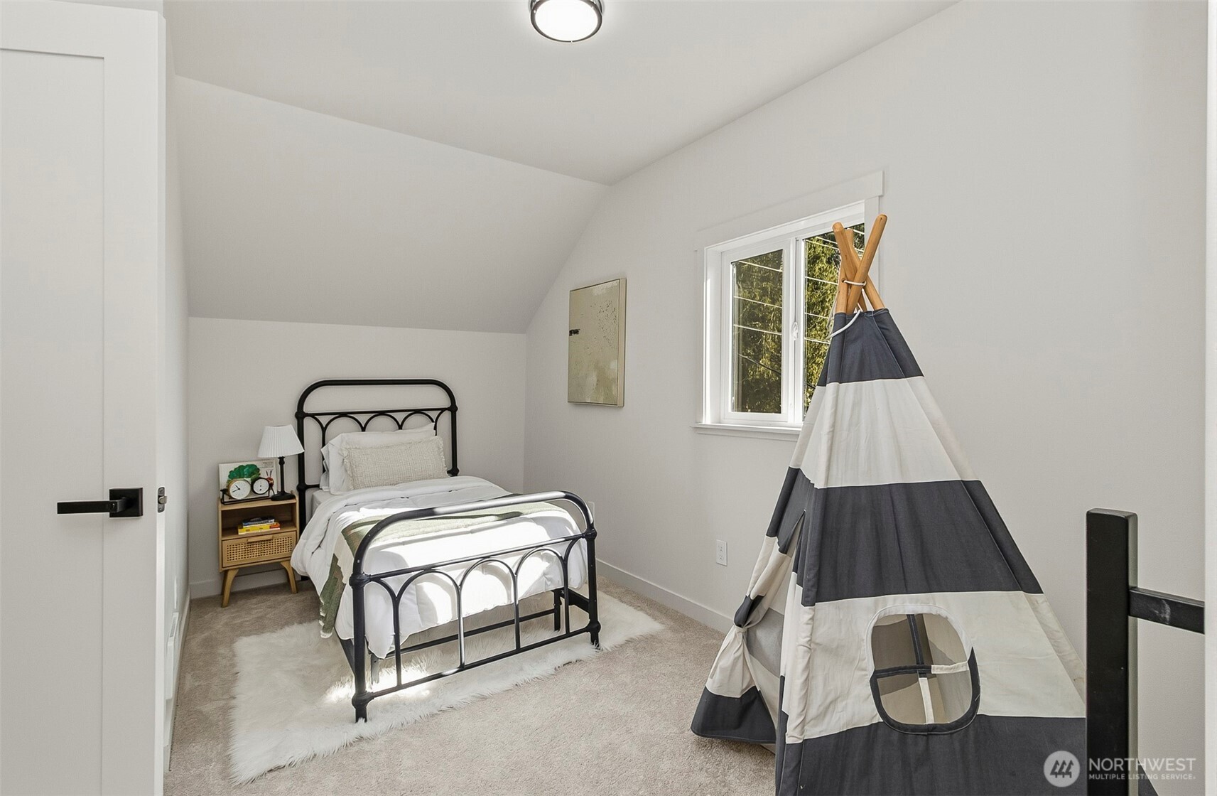 2816 Callow Road Lake Stevens, WA 98258 - Photo 23 of 34 a bedroom with a bed and wooden floor