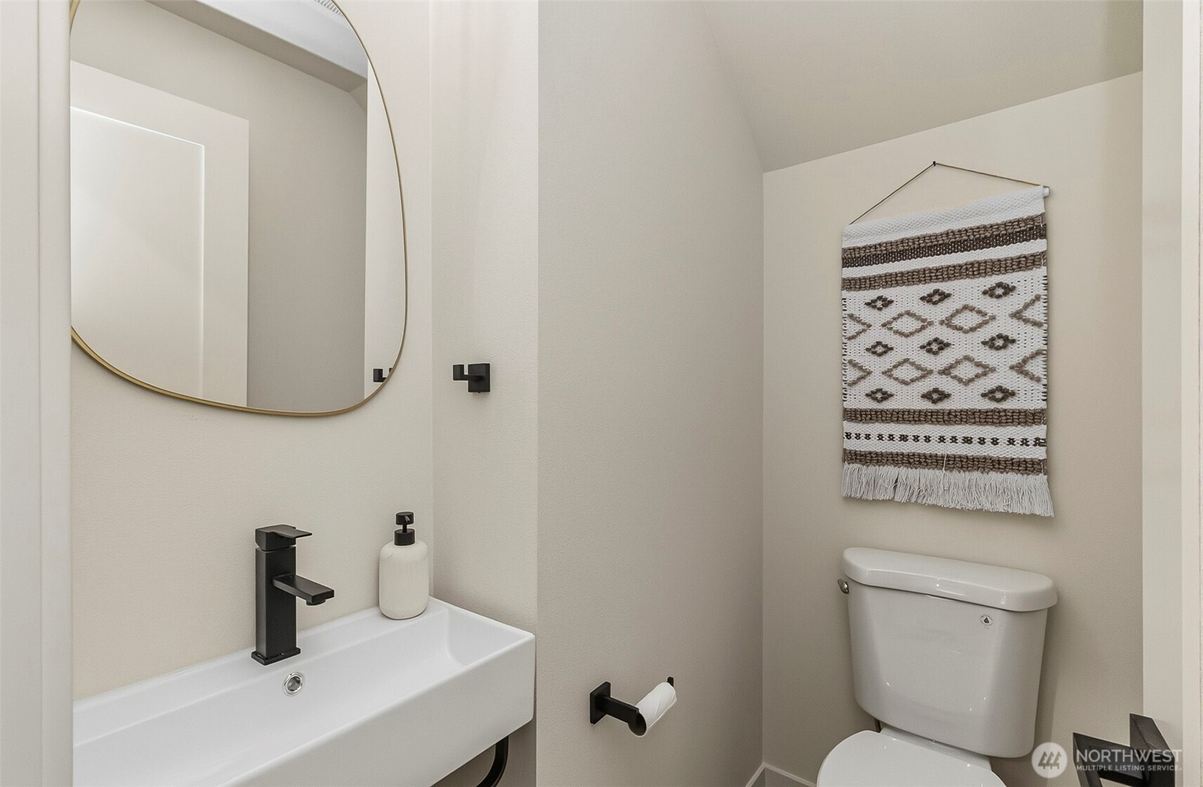 2816 Callow Road Lake Stevens, WA 98258 - Photo 6 of 34 a bathroom with a toilet a sink and mirror