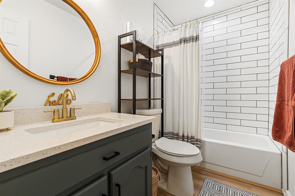 116 Marylee Drive Hewitt, TX 76643 - Photo 13 of 21 a bathroom with a sink a toilet and a mirror
