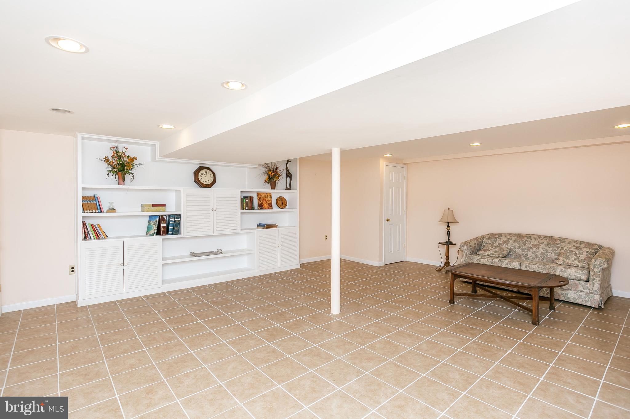 914 Breezewick Road Baltimore, MD 21286 - Photo 21 of 26 Large Rec Room with with Built-ins