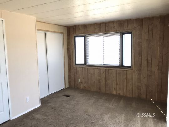 4233 West Ward Avenue Ridgecrest, CA 93555 - Photo 8 of 19 an empty room with windows