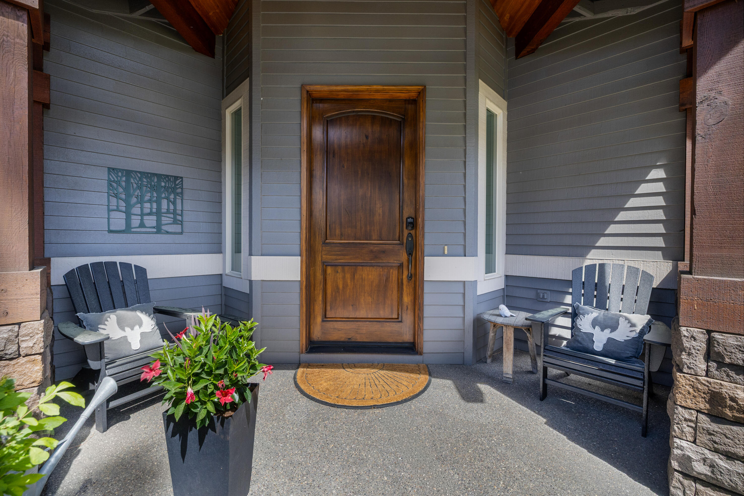 19460 Chip Shot Lane Bend, OR 97702 - Photo 4 of 56 a potted plant sitting in front of a house