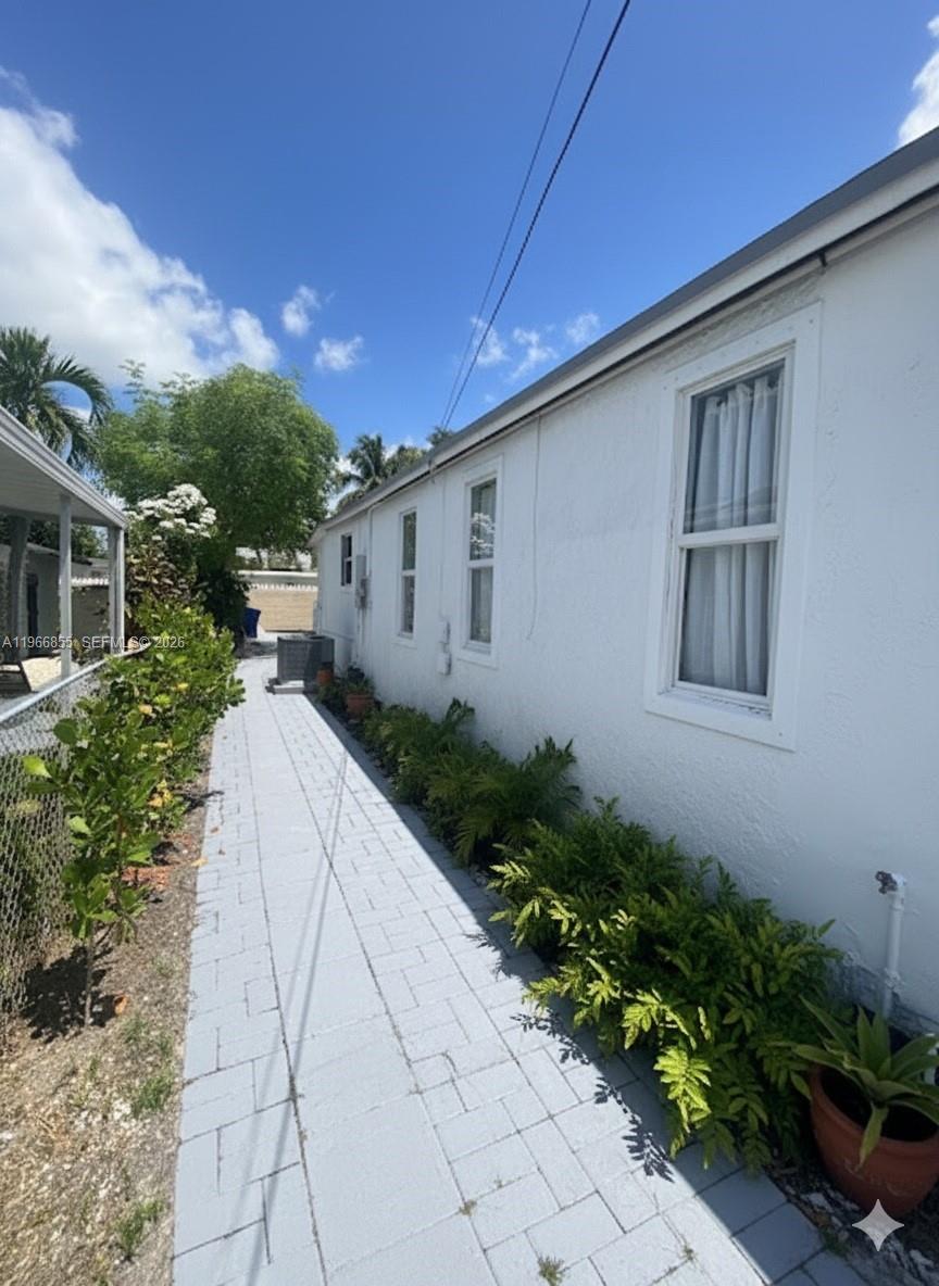 81 Northwest 44th Street, Unit 2 Miami, FL 33127 - Photo 2 of 6 a house view with a backyard space