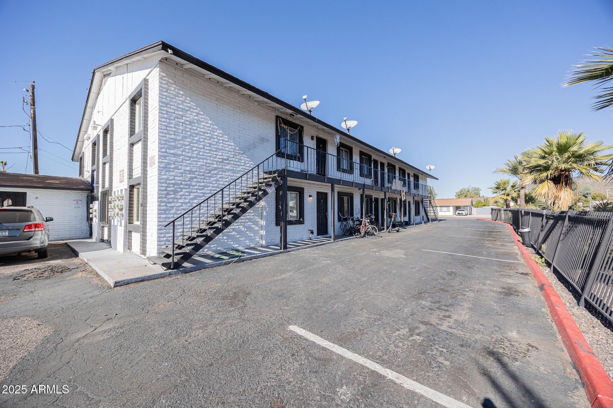 1703 West Mountain View Road, Unit 1 Phoenix, AZ 85021 - Photo 2 of 13 a view of street along with house and trees
