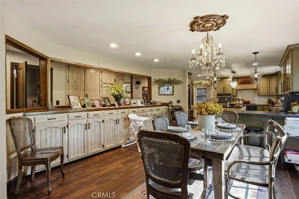 a kitchen with stainless steel appliances granite countertop a sink a stove and refrigerator