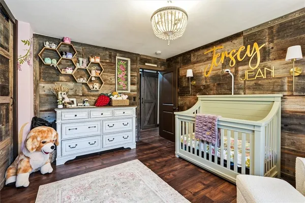 a bedroom with a large bed and a couch