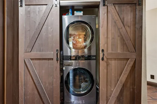 a bedroom with furniture and a large window