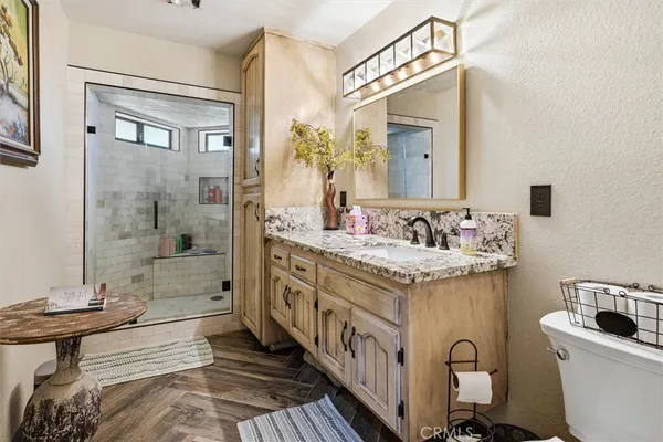a spacious bathroom with a sink double vanity and a mirror
