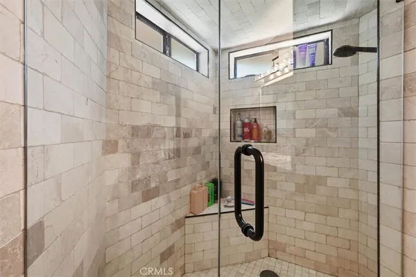 a bathroom with a bathtub and shower