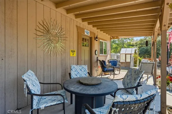 a bathroom with a granite countertop sink toilet a mirror a vanity and shower