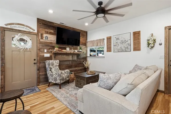 a view of a backyard with wooden fence