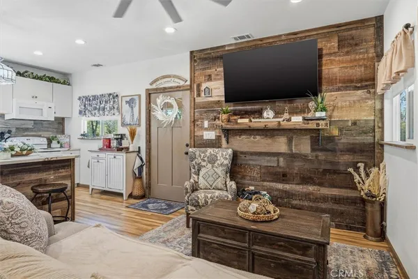 an aerial view of a house with a yard and large trees
