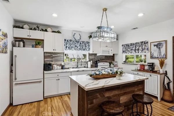 an aerial view of a house with garden space and street view