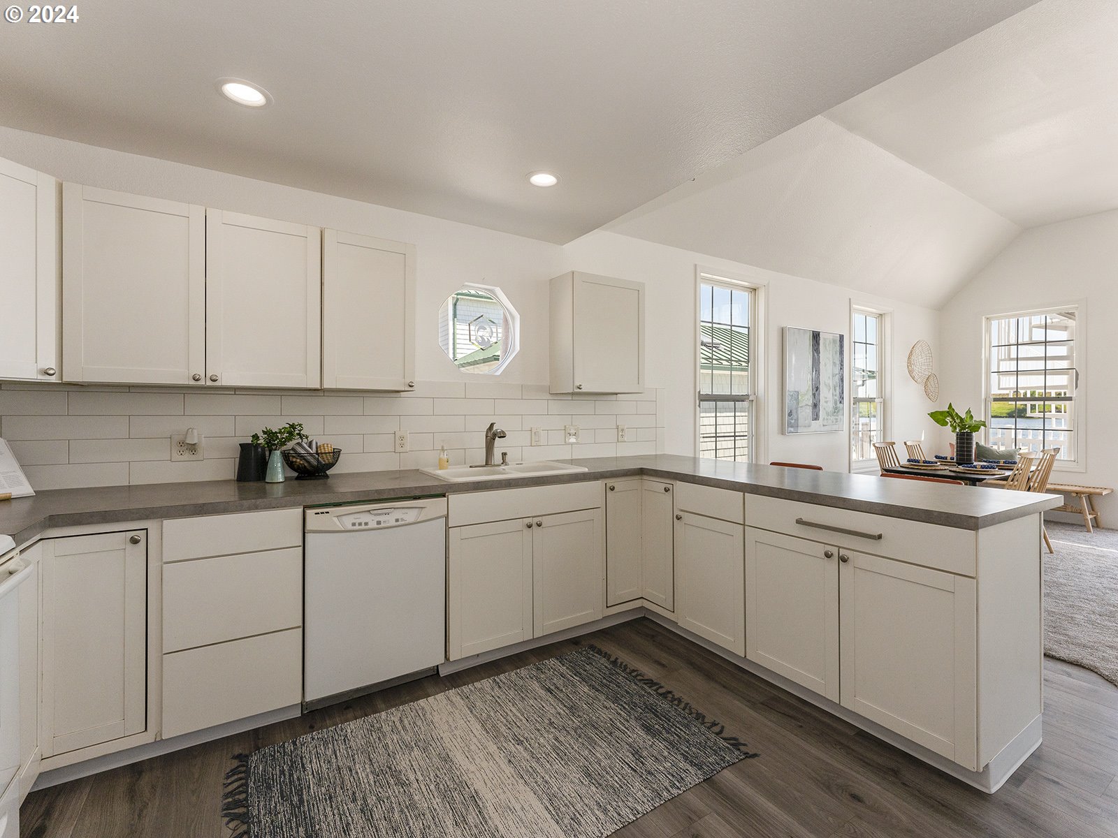 23560 Northwest St Helens Road, Unit N4 Portland, OR 97231 - Photo 13 of 37 a kitchen with sink cabinets and window