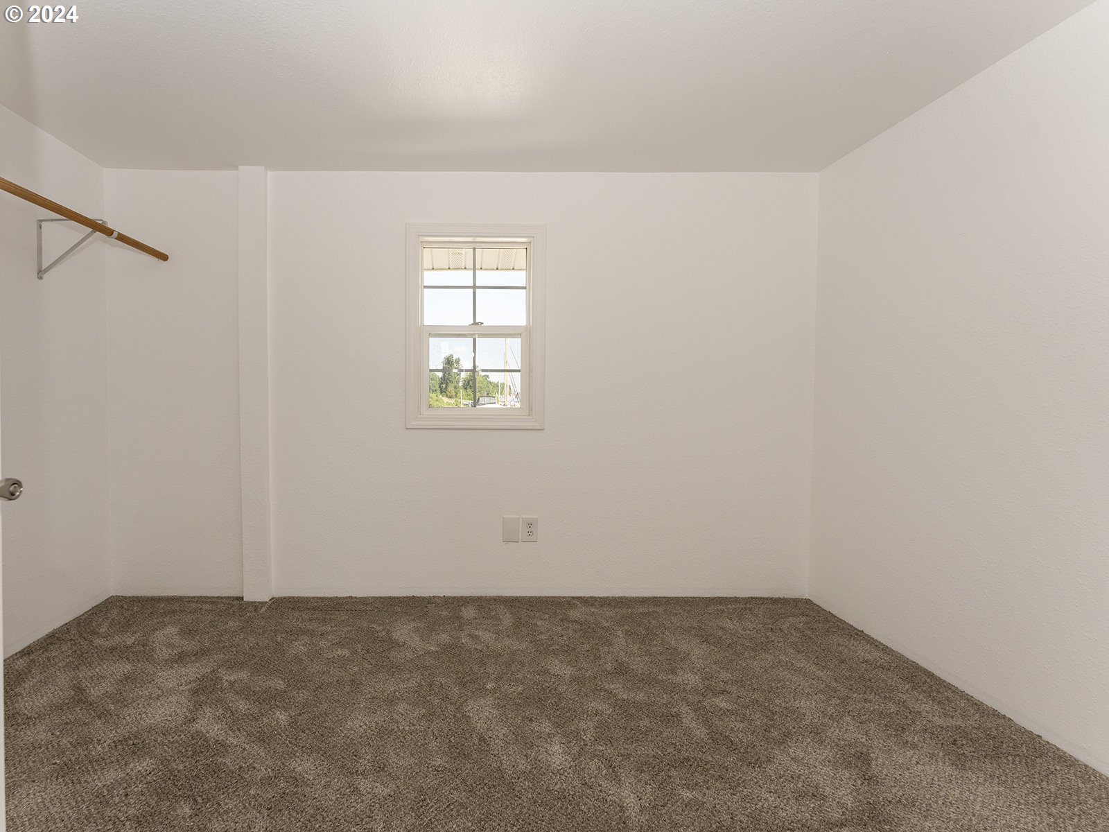 23560 Northwest St Helens Road, Unit N4 Portland, OR 97231 - Photo 15 of 37 an empty room with a window