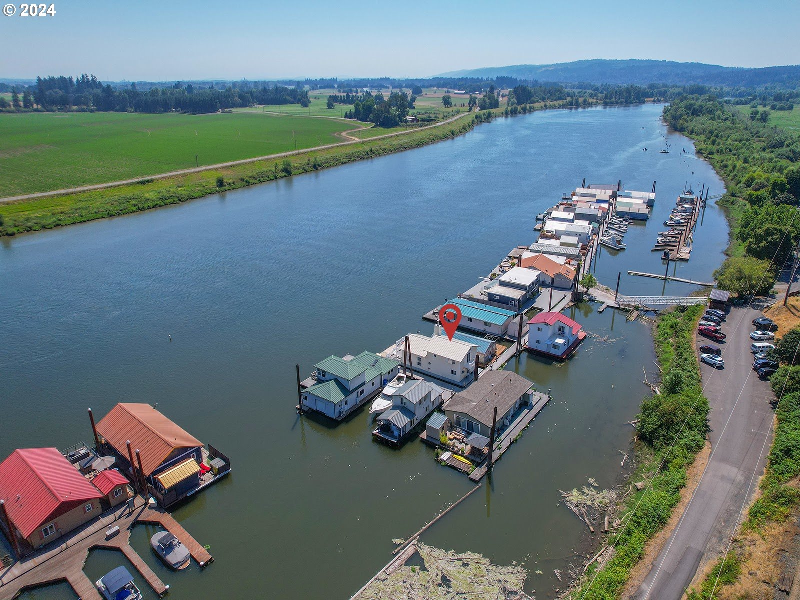 23560 Northwest St Helens Road, Unit N4 Portland, OR 97231 - Photo 2 of 37 an aerial view of a house with a lake view