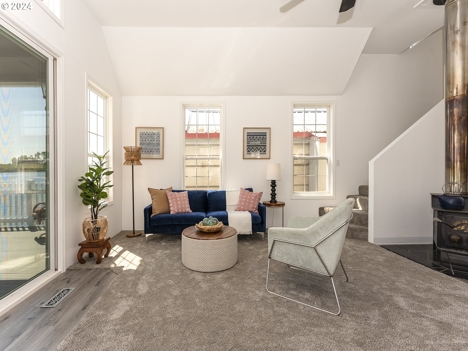 23560 Northwest St Helens Road, Unit N4 Portland, OR 97231 - Photo 8 of 37 a living room with furniture and a potted plant