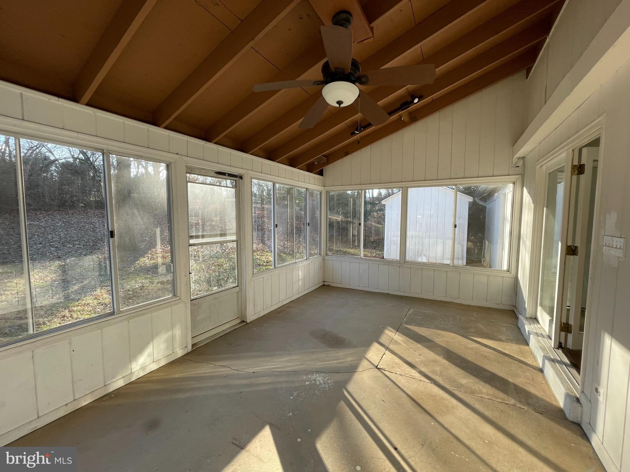 7004 Wick Lane Derwood, MD 20855 - Photo 10 of 19 a view of a room with large windows