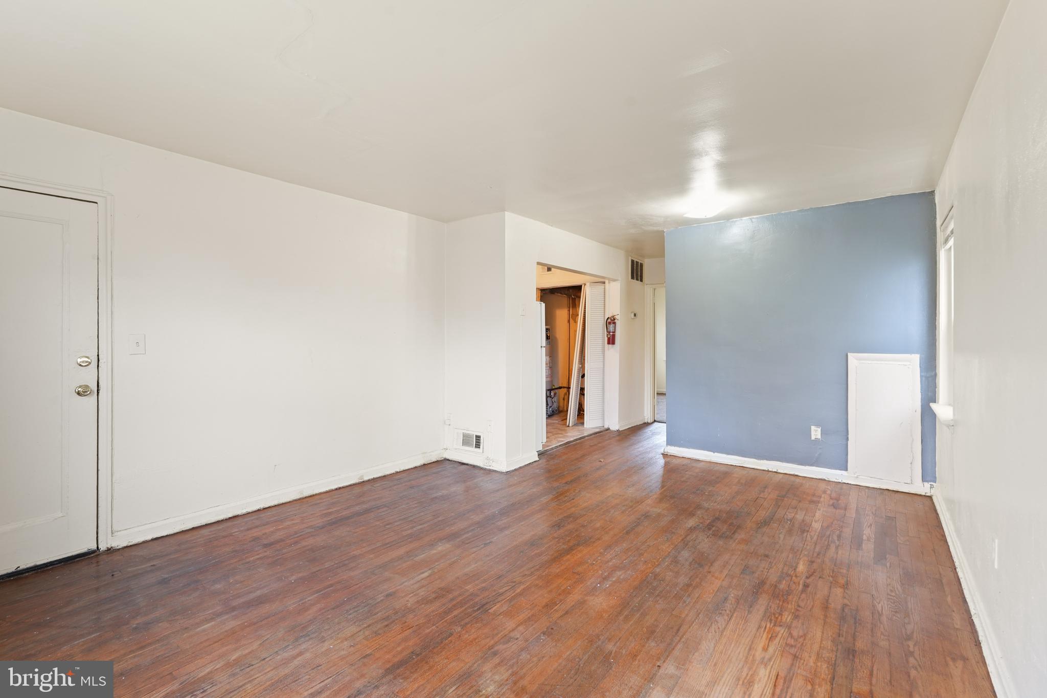 2303 S Street Southeast Washington, DC 20020 - Photo 4 of 18 a view of an empty room and wooden floor