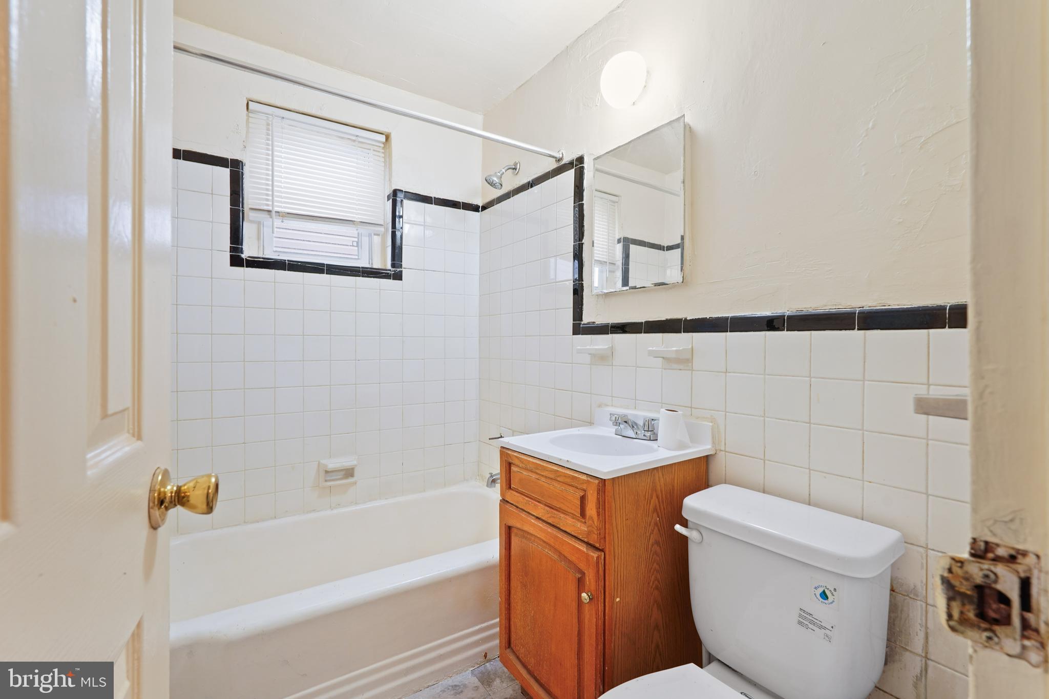 2303 S Street Southeast Washington, DC 20020 - Photo 8 of 18 a bathroom with a sink toilet and shower