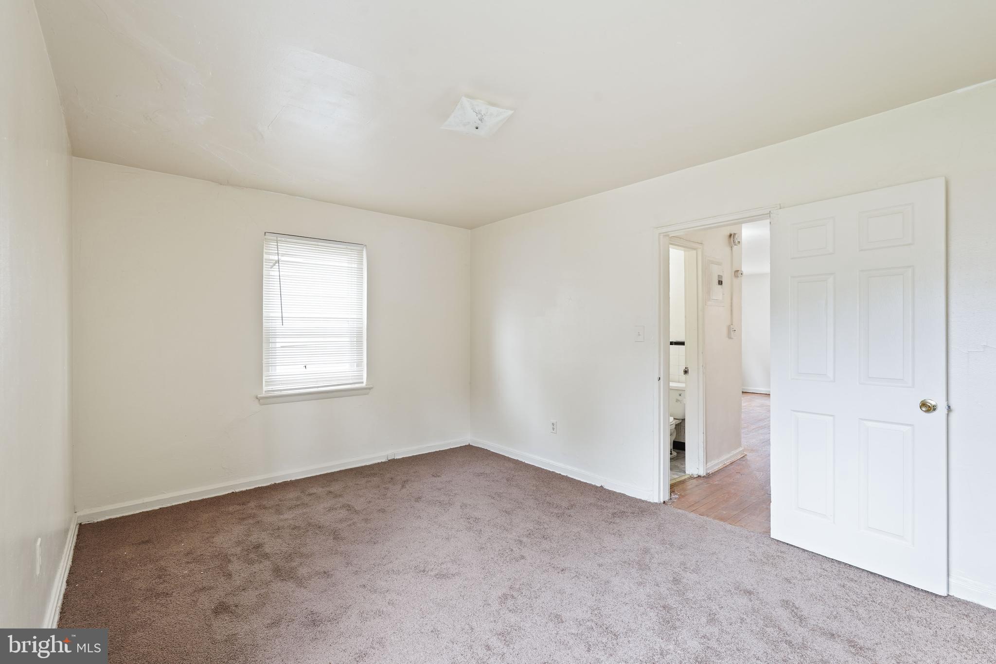 2303 S Street Southeast Washington, DC 20020 - Photo 9 of 18 a view of an empty room with a window