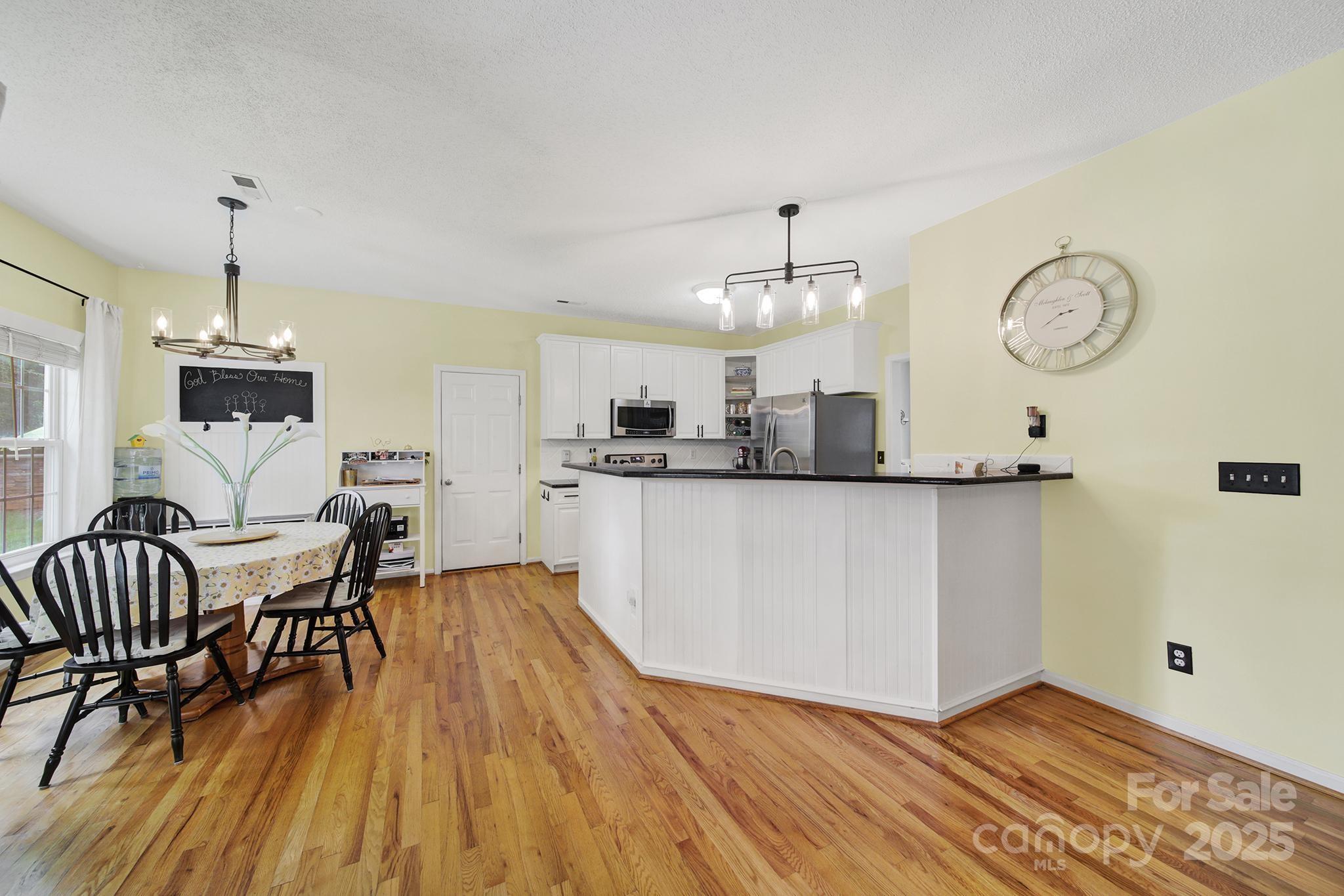 488 St George Road Fort Mill, SC 29708 - Photo 11 of 40 a view of a dining room with furniture window and wooden floor