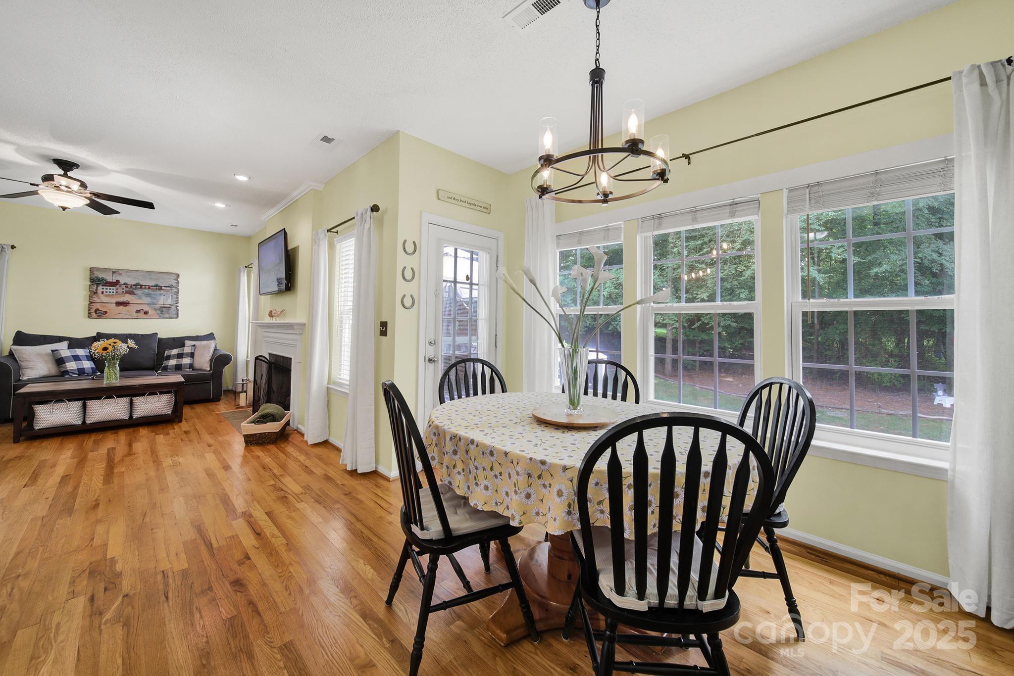 488 St George Road Fort Mill, SC 29708 - Photo 13 of 40 a view of a dining room with furniture window and wooden floor