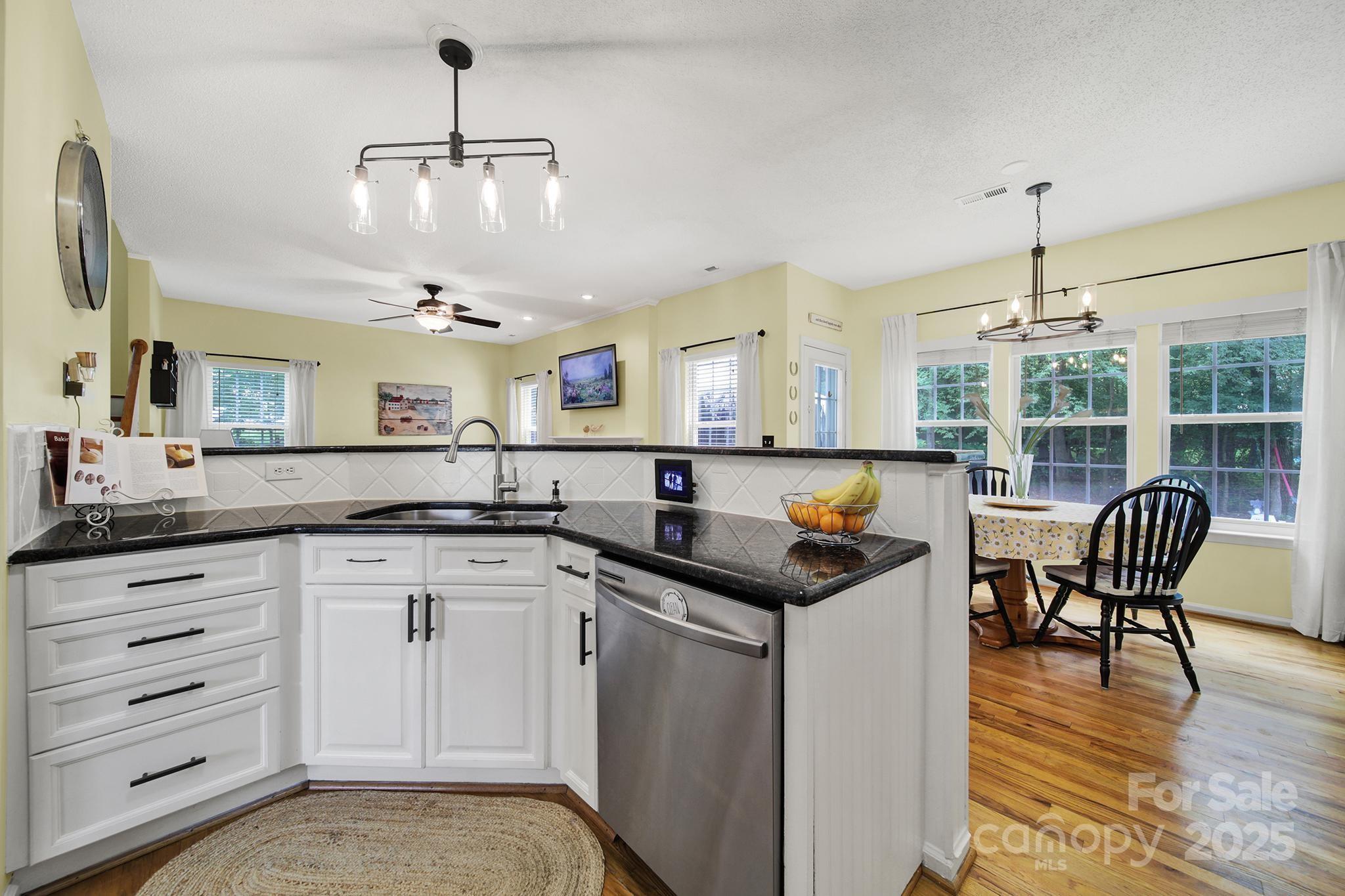 488 St George Road Fort Mill, SC 29708 - Photo 14 of 40 a kitchen with stainless steel appliances granite countertop a sink and cabinets