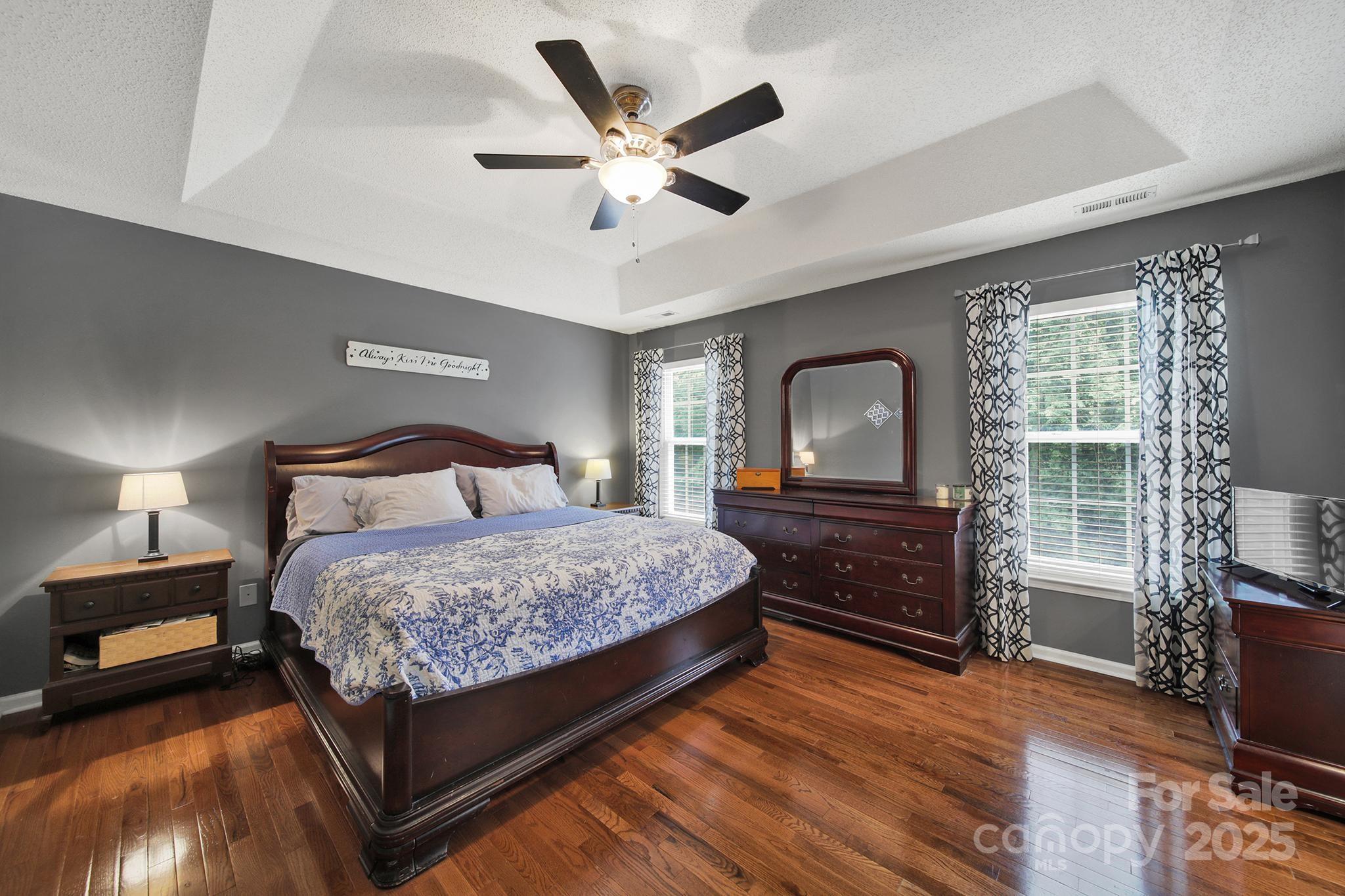 488 St George Road Fort Mill, SC 29708 - Photo 19 of 40 a bedroom with a bed and wooden floor