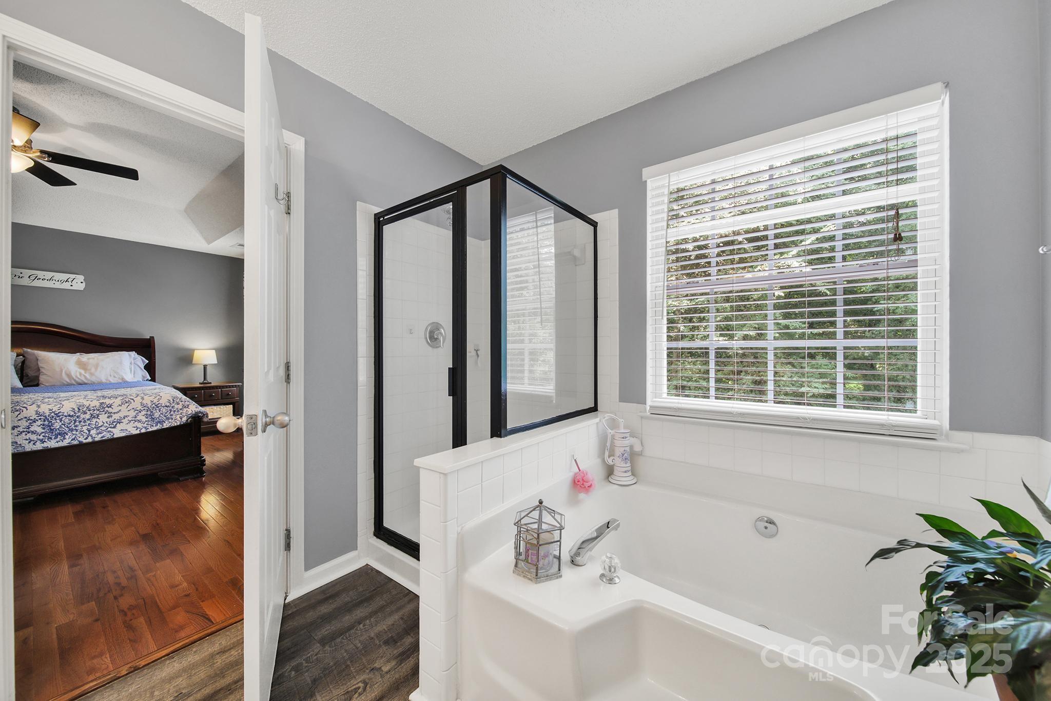 488 St George Road Fort Mill, SC 29708 - Photo 23 of 40 a en suite spacious bathroom with a tub shower and window