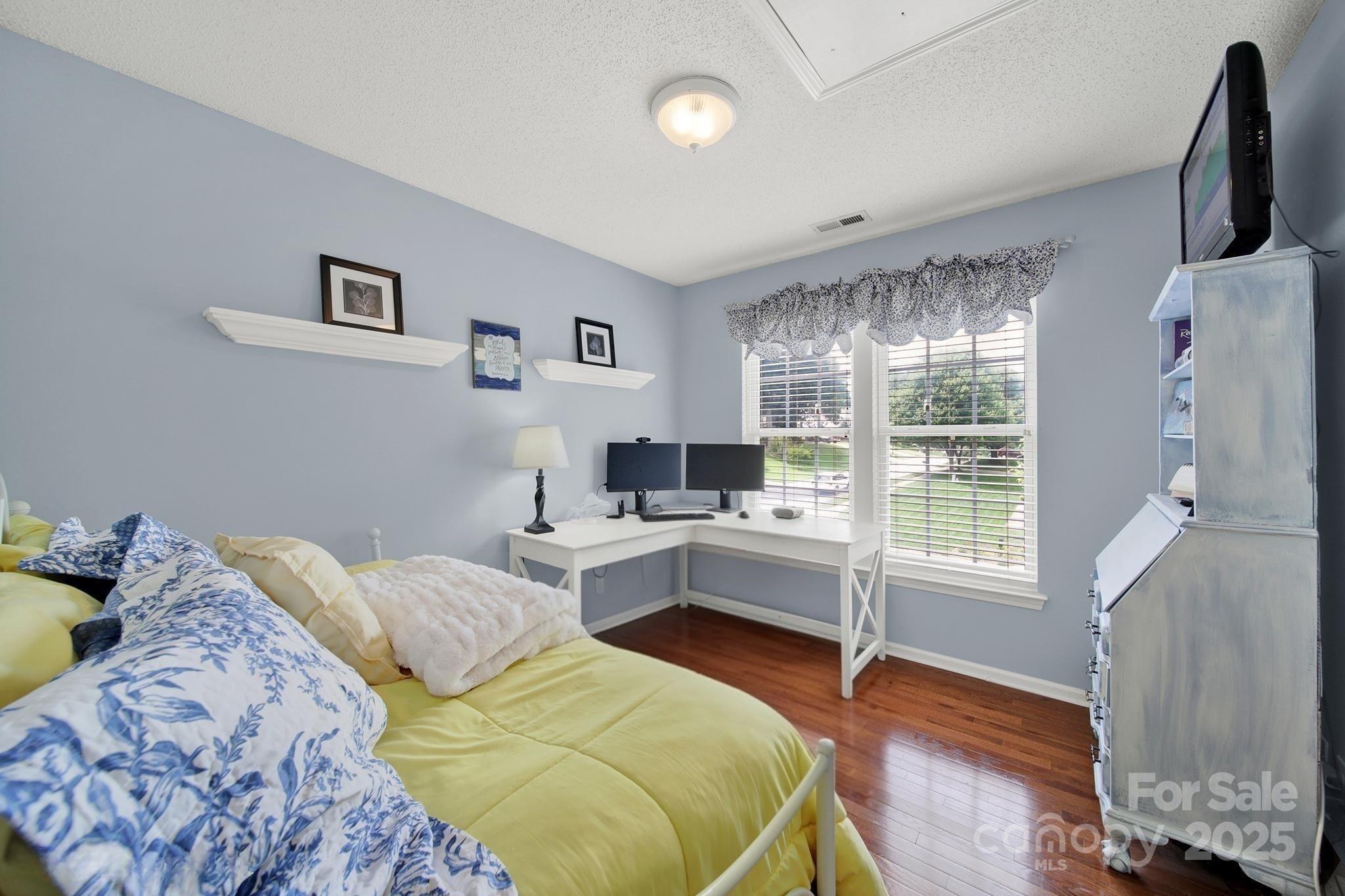 488 St George Road Fort Mill, SC 29708 - Photo 27 of 40 a bedroom with a bed and a desk