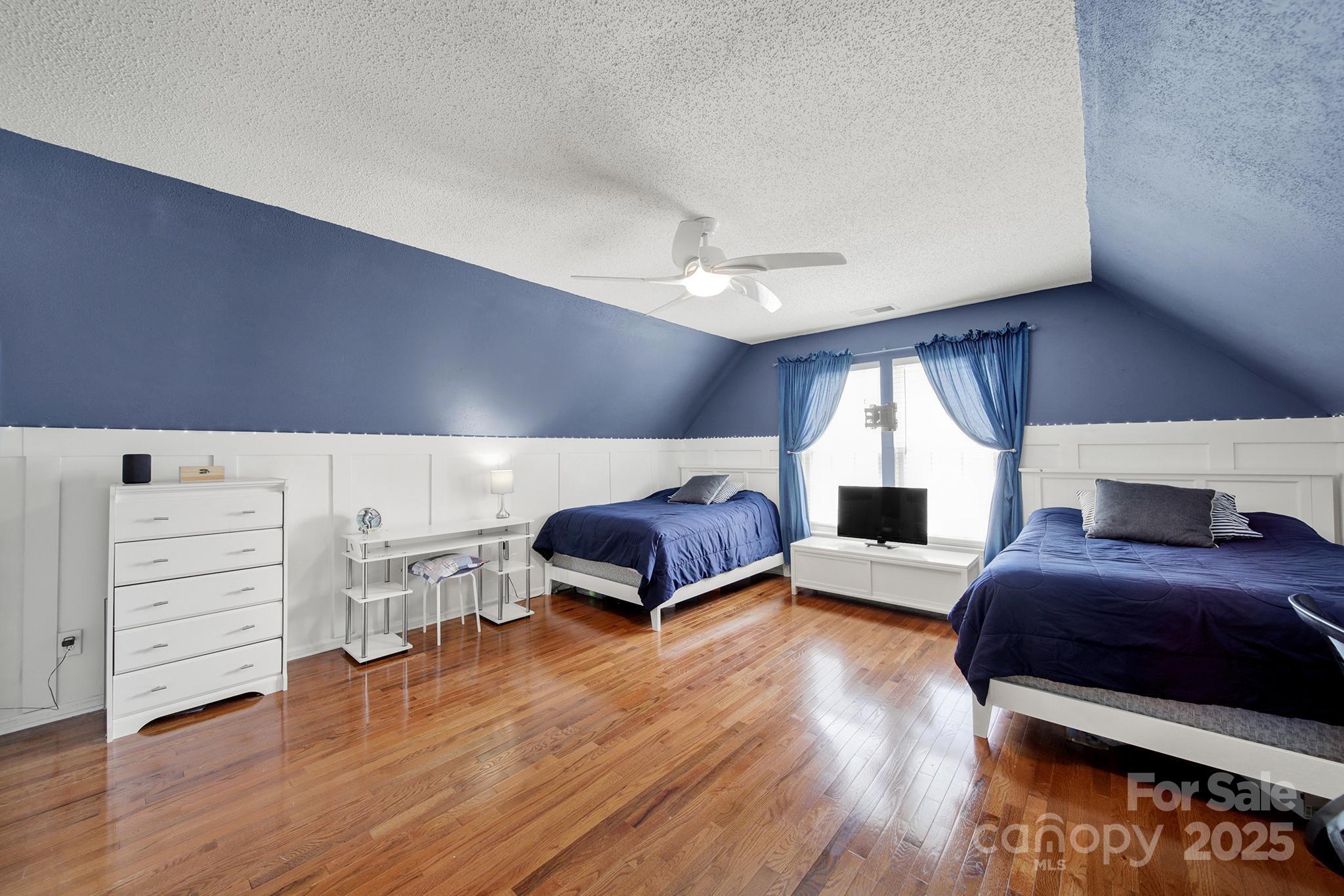 488 St George Road Fort Mill, SC 29708 - Photo 29 of 40 a bedroom with furniture and wooden floor