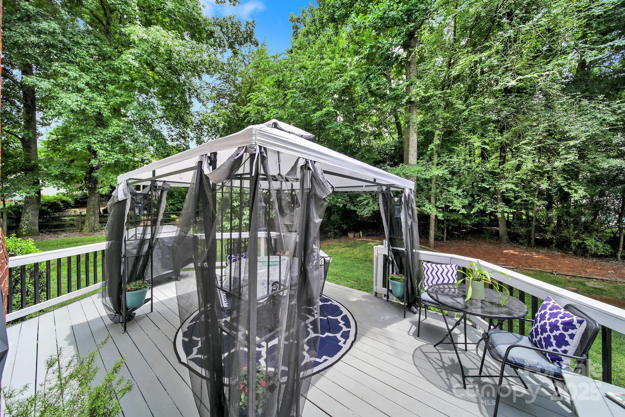488 St George Road Fort Mill, SC 29708 - Photo 35 of 40 a view of a patio with a table chairs and a backyard