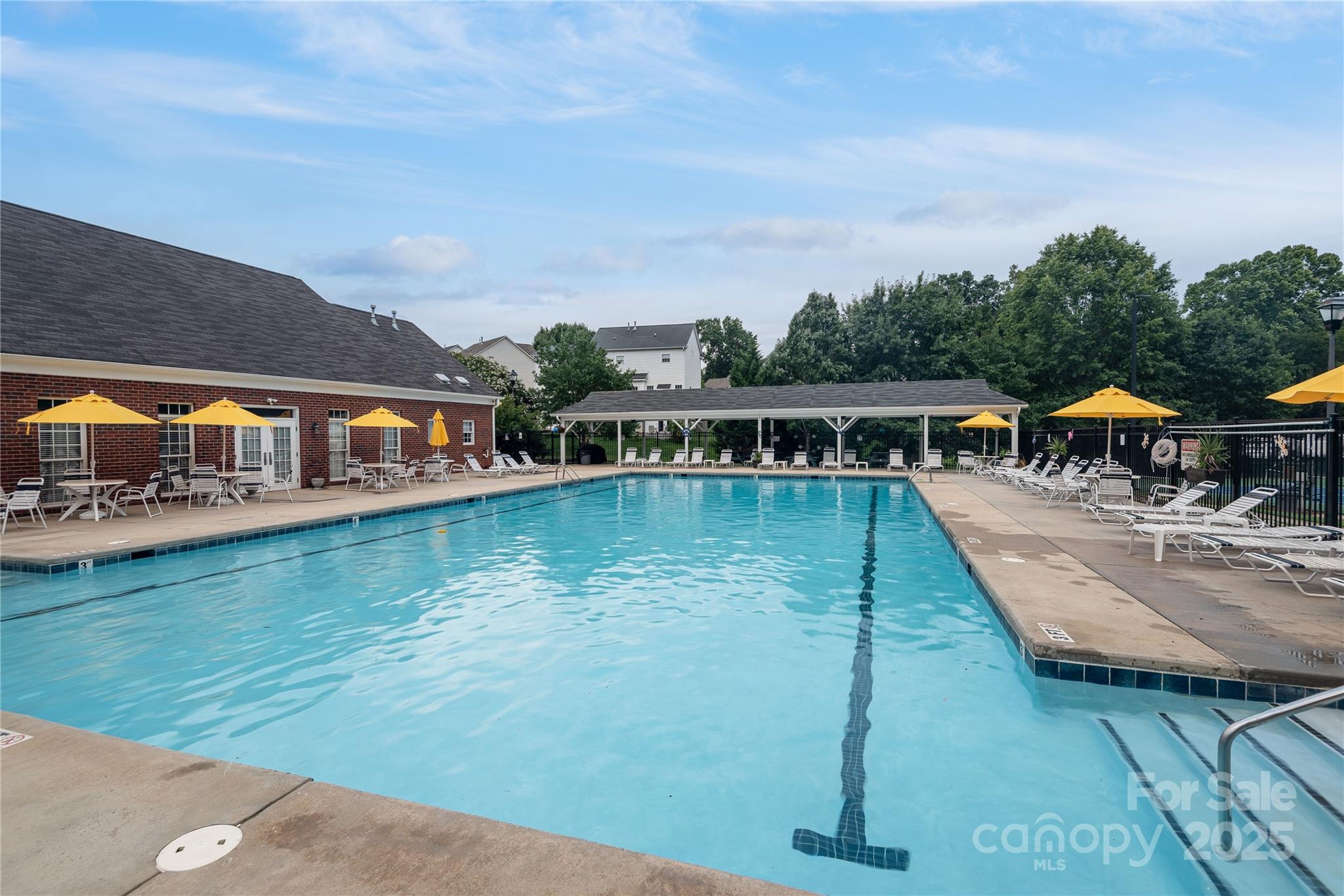 488 St George Road Fort Mill, SC 29708 - Photo 38 of 40 a view of swimming pool with lawn chairs under an umbrella