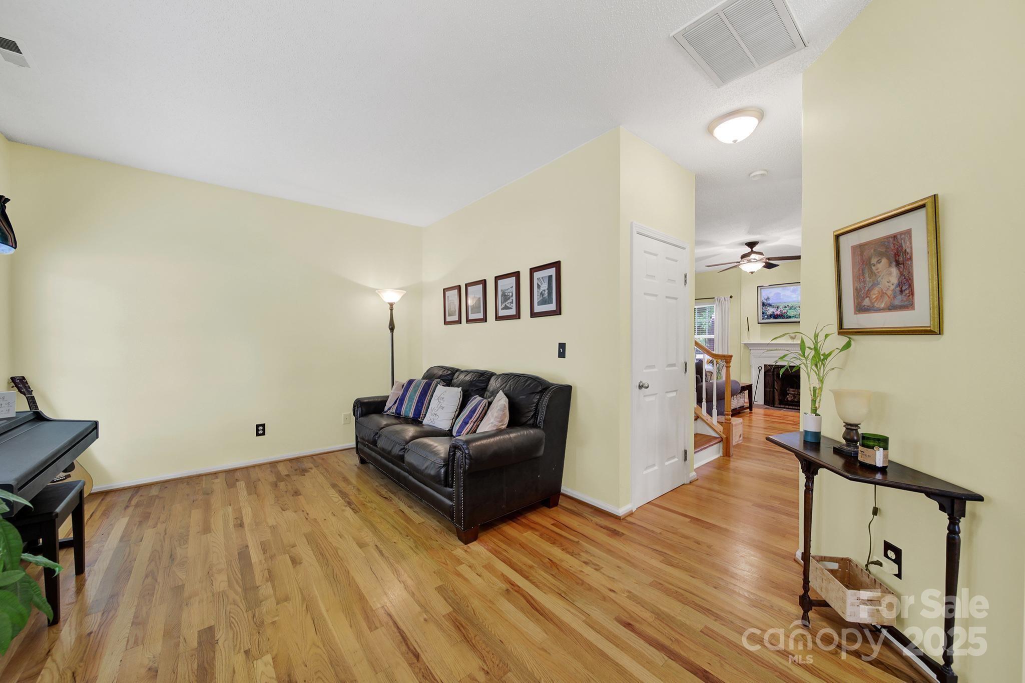 488 St George Road Fort Mill, SC 29708 - Photo 5 of 40 a living room with furniture and a wooden floor