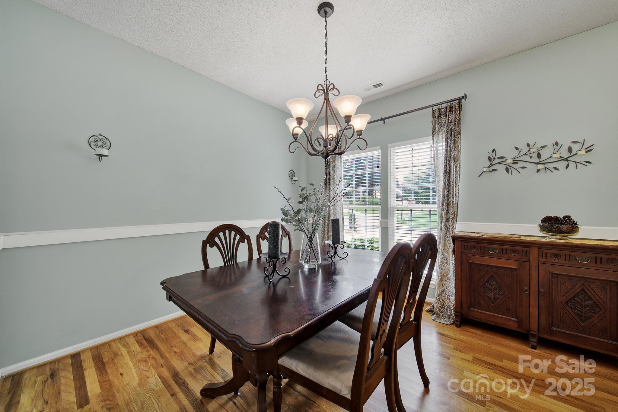 488 St George Road Fort Mill, SC 29708 - Photo 7 of 40 a dining room with furniture a chandelier and window