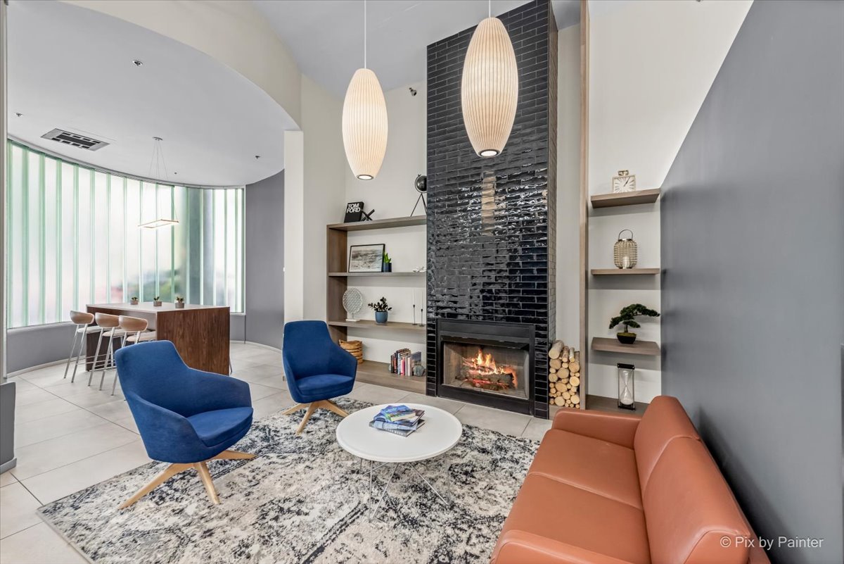 909 West Washington Boulevard, Unit 803 Chicago, IL 60607 - Photo 5 of 21 a living room with furniture and a fireplace