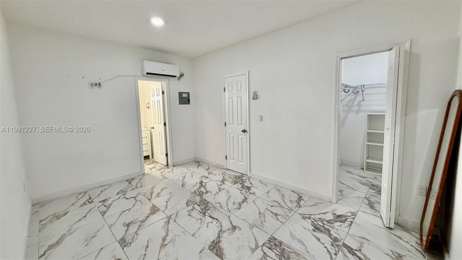12435 Southwest 42nd Street, Unit 2 Miami, FL 33175 - Photo 5 of 8 a view of a bathroom with a sink and a mirror
