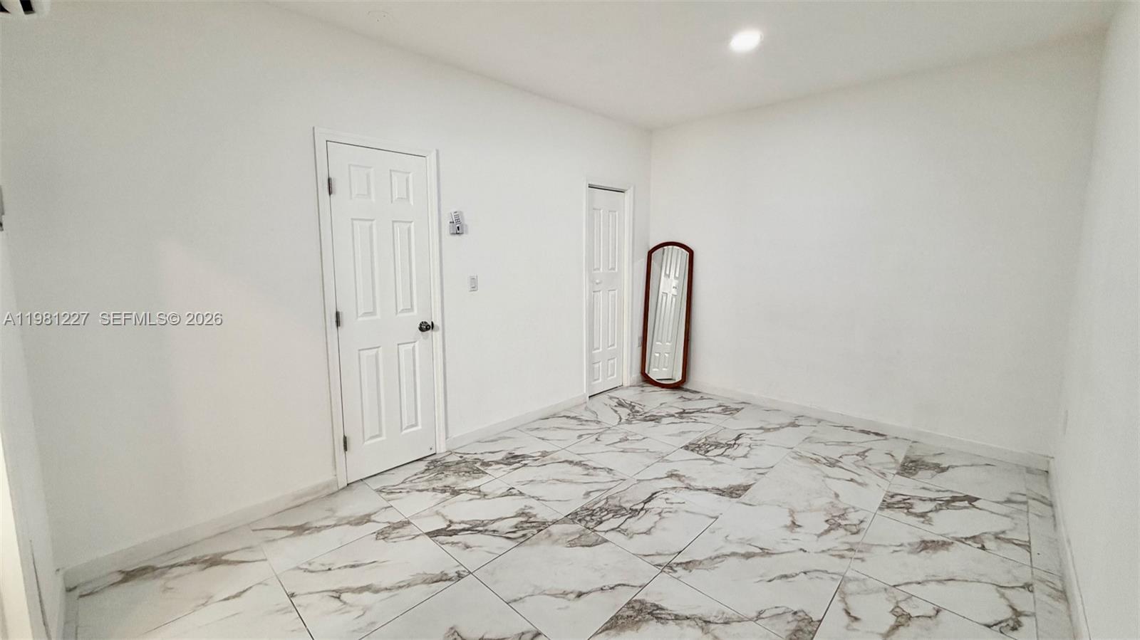 12435 Southwest 42nd Street, Unit 2 Miami, FL 33175 - Photo 6 of 8 a view of a room with a sink