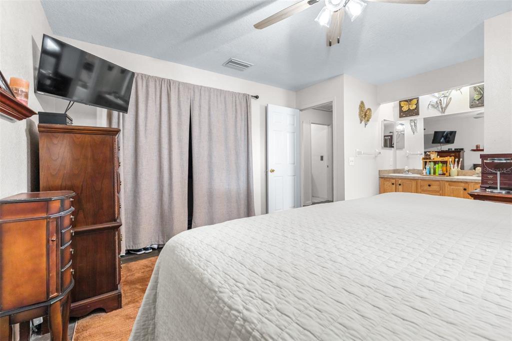 1645 County Road 630 Frostproof, FL 33843 - Photo 23 of 76 a bedroom with a bed and a television