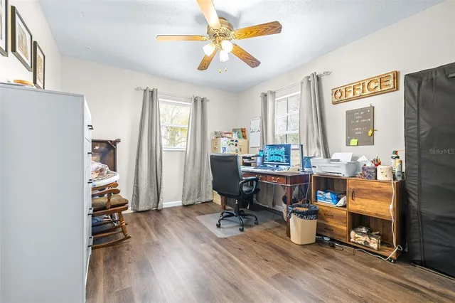 a bathroom with a granite countertop sink toilet and a bathtub