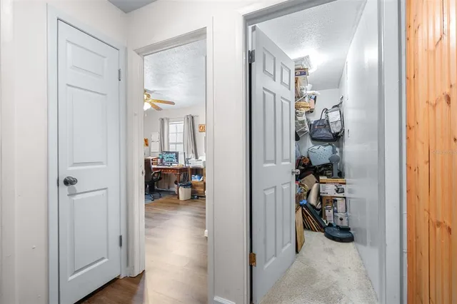 a view of a chairs and tables in the backyard of the house