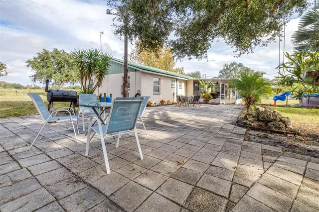 a row of palm trees in front of house
